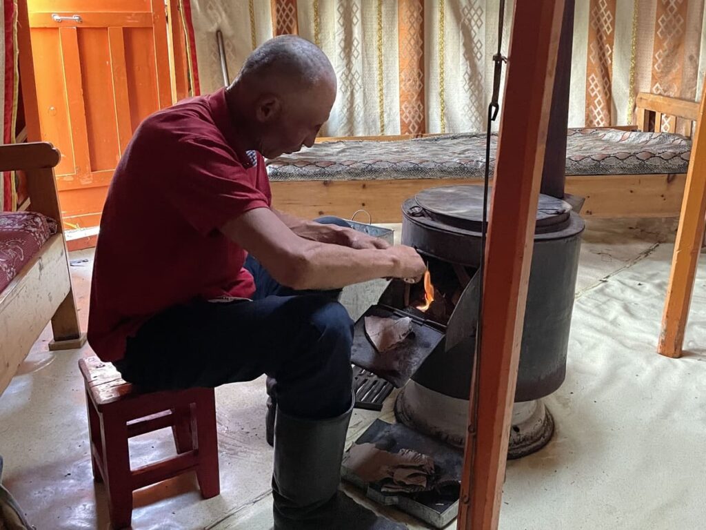 Char lighting a fire